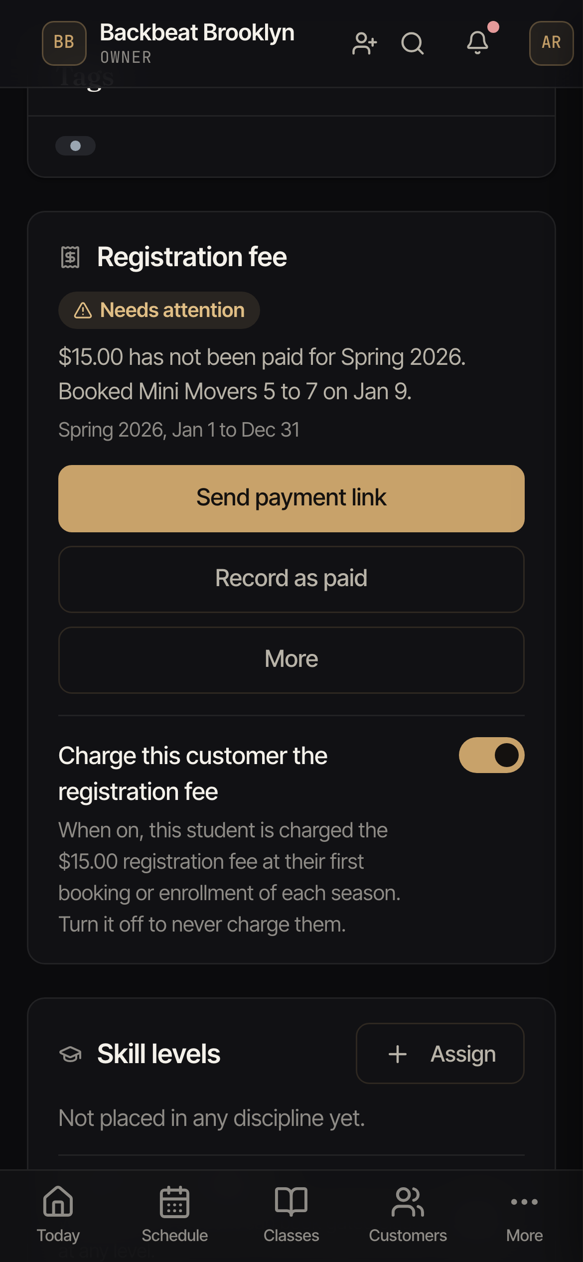The Registration fee card on a customer profile, showing Needs attention, the reason, the season, the Send payment link, Record as paid and More buttons, and the Charge this customer the registration fee switch.